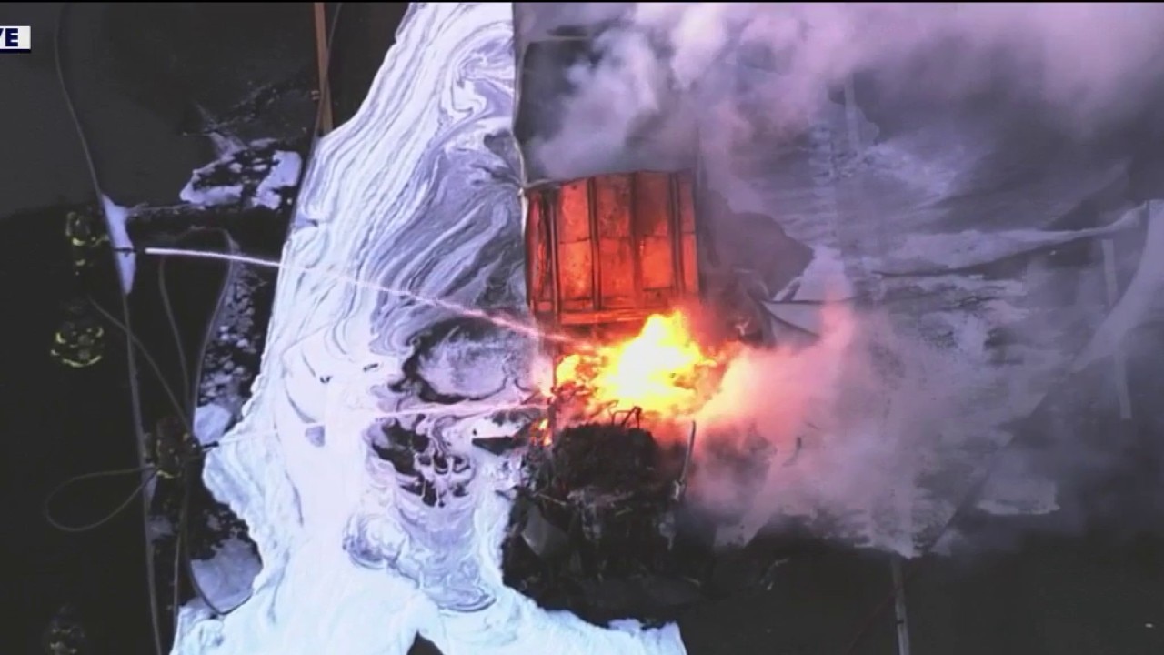 Tesla semi truck engulfed in flames on I-880 in Hayward, causing traffic delays.